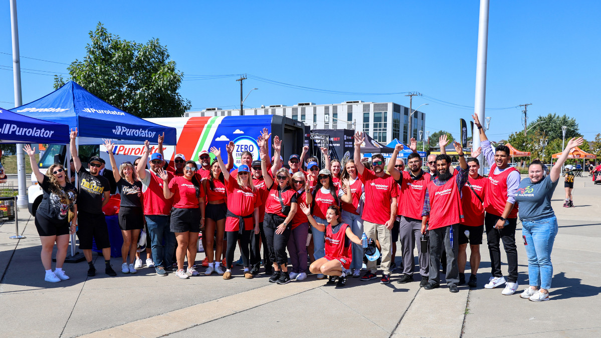 Purolator and Hamilton Food Share volunteers pose for a photo at the Labour Day Classic Game 2025.  